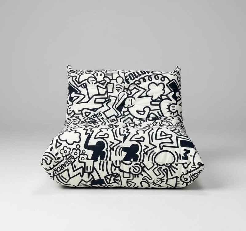 Black and white patterned bean bag chair on a gray background