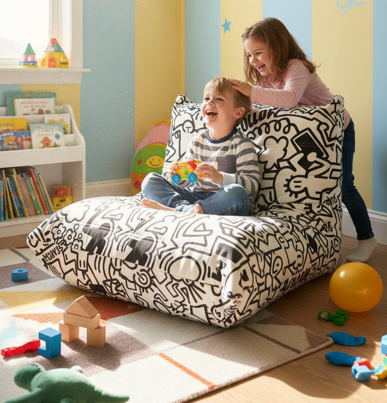 Children playing on a bean bag with toys around in a colorful room.